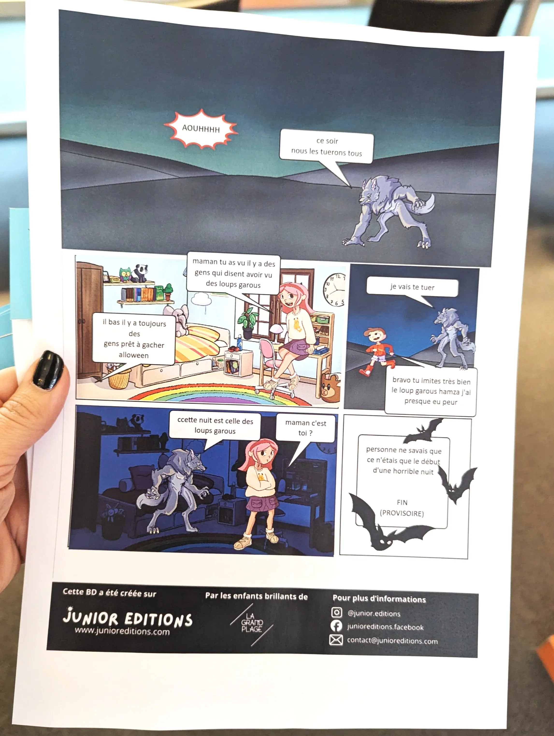 A printed comic page held in one hand, with human characters and a werewolf, a conversation about a night and werewolves.